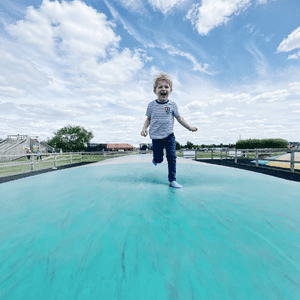  Child smiling on a Jumping Pillow