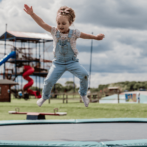  Child jumping on a trampoline