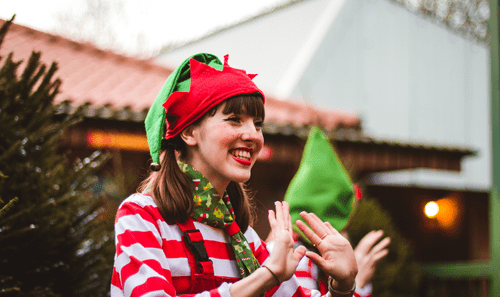 Elf waving at The Real Christmas Experience