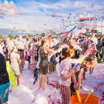 Children playing in a foam party