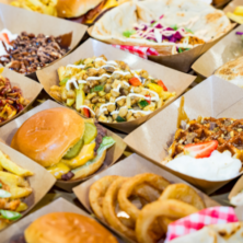 Selection of food in brown paper trays