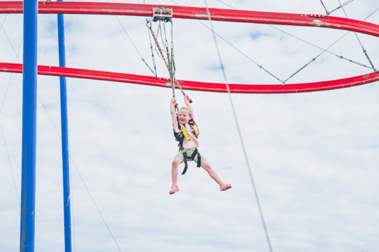 young girl riding the skyrider at rand farm park