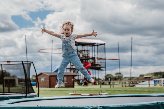  Child jumping on a trampoline